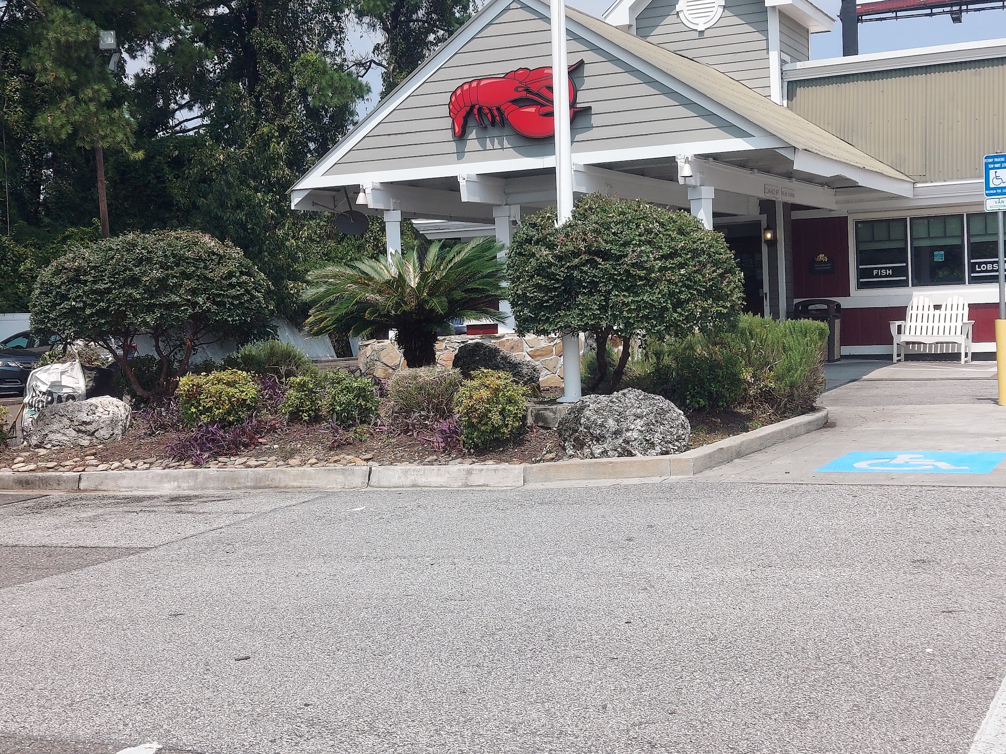Shrubs and rocks landscaped at a restaurant entrance